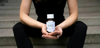 A woman holding a container